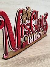 Load image into Gallery viewer, Mrs. Claus' Bakery Shelf Sitter Christmas Standing Sign File SVG, Santa Gingerbread Mantle decor Centerpiece glowforge LuckyHeartDesignsCo