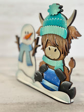 Load image into Gallery viewer, Snowman Highland Cow Winter Standing File SVG, Snowflake, Farm, Frosty, Holiday, Tiered Tray, Glowforge, LuckyHeartDesignsCo