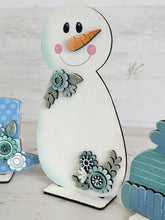 Load image into Gallery viewer, Chunky Snowman Floral Winter Standing File SVG, Glowforge, Hat, Mitten, Snowflake, Tiered Tray LuckyHeartDesignsCo