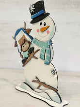 Load image into Gallery viewer, Highland Standing Winter Snowman Peeking File SVG, Snowflake, Cow, Farm, Frosty, Holiday, Tiered Tray, Glowforge, LuckyHeartDesignsCo