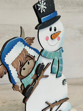 Load image into Gallery viewer, Highland Standing Winter Snowman Peeking File SVG, Snowflake, Cow, Farm, Frosty, Holiday, Tiered Tray, Glowforge, LuckyHeartDesignsCo