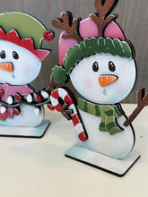 Load image into Gallery viewer, Snowman Cute Christmas Standing Sign File SVG, Santa, Winter, Candy Cane, Snowmen, Rudolph, Centerpiece glowforge LuckyHeartDesignsCo