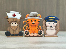 Load image into Gallery viewer, Animal Hats Professions Interchangeable File SVG, add on Fireman, Construction, Nurse, Coach, Police, Pilot, Glowforge, LuckyHeartDesignsCo