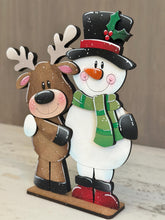 Load image into Gallery viewer, Reindeer Snowman Hug Christmas Standing File SVG, Santa, Winter, Snowmen, Friends, Rudolph, Centerpiece glowforge LuckyHeartDesignsCo
