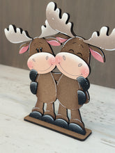 Load image into Gallery viewer, Moose Hugs Standing Sign File SVG, Elf Reindeer Santa, Sweater Reindeer Mantle decor, Centerpiece, glowforge, LuckyHeartDesignsCo