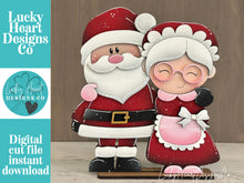 Load image into Gallery viewer, Santa Mrs. Claus Hug Christmas Standing File SVG, Cookies, Couple, Bakery, Tiered Tray, Centerpiece glowforge LuckyHeartDesignsCo