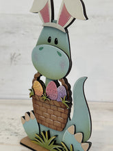 Load image into Gallery viewer, Easter Dinosaur Holding Basket Standing File SVG, Glowforge, Egg, Triceratops, T-rex, Dino Bunny, LuckyHeartDesignsCo
