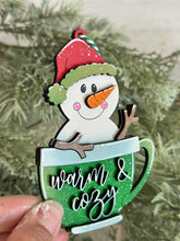 Load image into Gallery viewer, Mug Friends Snowman Christmas Ornament File SVG, Santa, Winter, Cocoa, Coffee, Cup, Frosty, Glowforge, LuckyHeartDesignsCo
