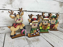 Load image into Gallery viewer, Reindeer Cute Christmas Standing Sign File SVG, Santa, Wreath, Candy Cane, Prenet, Rudolph, Centerpiece glowforge LuckyHeartDesignsCo
