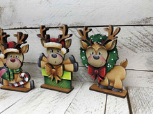Load image into Gallery viewer, Reindeer Cute Christmas Standing Sign File SVG, Santa, Wreath, Candy Cane, Prenet, Rudolph, Centerpiece glowforge LuckyHeartDesignsCo
