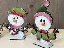 Load image into Gallery viewer, Snowman Cute Christmas Standing Sign File SVG, Santa, Winter, Candy Cane, Snowmen, Rudolph, Centerpiece glowforge LuckyHeartDesignsCo
