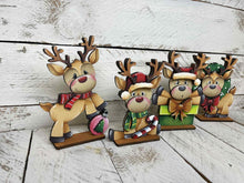 Load image into Gallery viewer, Reindeer Cute Christmas Standing Sign File SVG, Santa, Wreath, Candy Cane, Prenet, Rudolph, Centerpiece glowforge LuckyHeartDesignsCo
