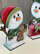 Load image into Gallery viewer, Snowman Cute Christmas Standing Sign File SVG, Santa, Winter, Candy Cane, Snowmen, Rudolph, Centerpiece glowforge LuckyHeartDesignsCo
