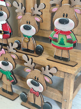 Load image into Gallery viewer, Reindeer Merry Christmas Standing Sign File SVG, Santa, Wreath, Candy Cane, Present Rudolph, Centerpiece glowforge LuckyHeartDesignsCo
