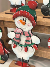 Load image into Gallery viewer, Happy Snowman Christmas Standing File SVG, Santa, Winter, Candy Cane, Snowmen, Wreath, Rudolph, Centerpiece glowforge LuckyHeartDesignsCo

