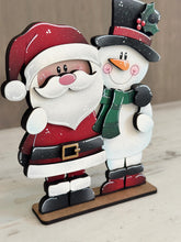Load image into Gallery viewer, Santa Snowman Hug Christmas Standing File SVG, Snowmen, Love, Frosty, Winter, Centerpiece glowforge LuckyHeartDesignsCo
