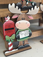 Load image into Gallery viewer, Happy Moose Christmas Standing Sign File SVG, Elf Reindeer Santa, Sweater Reindeer Mantle decor, Centerpiece, glowforge, LuckyHeartDesignsCo
