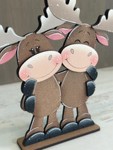 Load image into Gallery viewer, Moose Hugs Standing Sign File SVG, Elf Reindeer Santa, Sweater Reindeer Mantle decor, Centerpiece, glowforge, LuckyHeartDesignsCo
