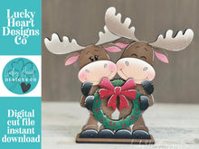 Load image into Gallery viewer, Moose Wreath Hugs Standing Sign File SVG, Elf Reindeer Santa, Sweater Reindeer Mantle decor, Centerpiece, glowforge, LuckyHeartDesignsCo
